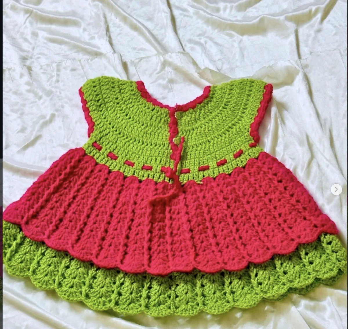 A handmade crochet dress up close